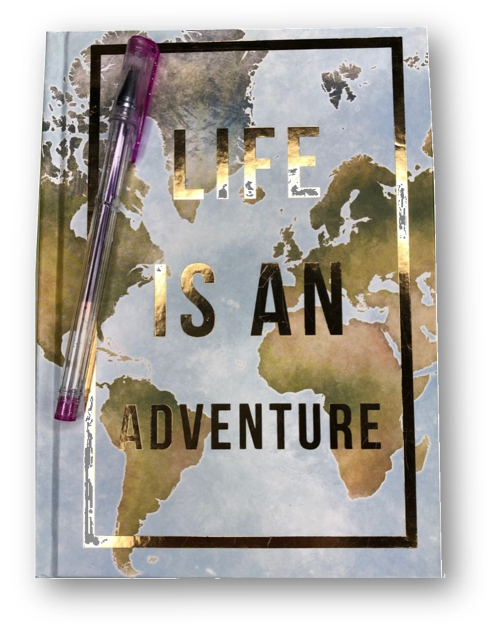 Photograph of a closed journal. Cover reads, "Life is an Adventure."