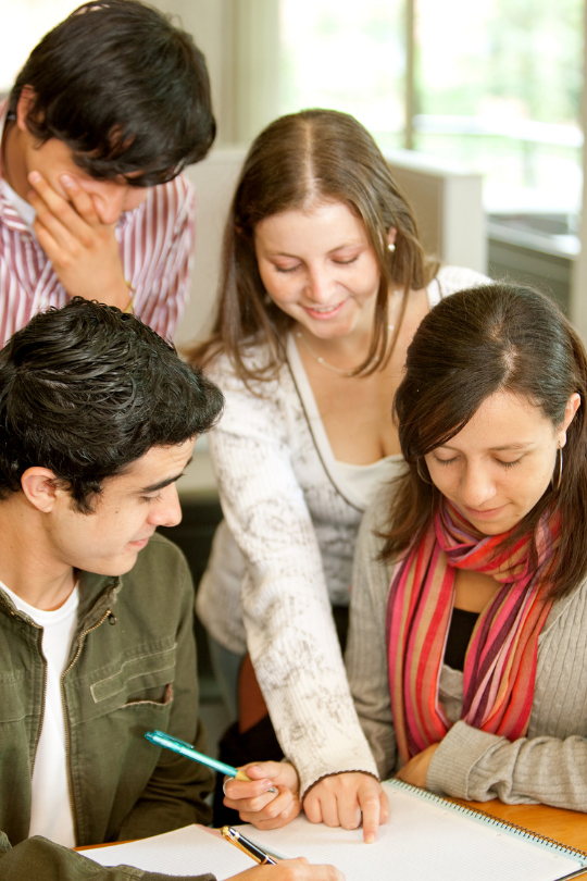 Picture of four students working on an activity together.